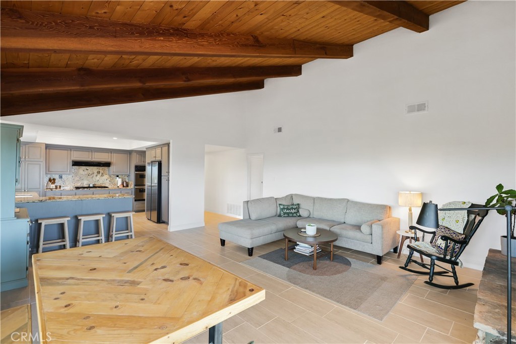33532 Valle Road San Juan Capistrano, CA 92675 - Photo 52 of 60 a living room with dining room and wooden floor
