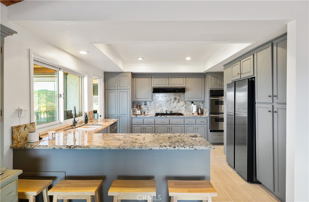 33532 Valle Road San Juan Capistrano, CA 92675 - Photo 54 of 60 a room with stainless steel appliances granite countertop a refrigerator and a sink