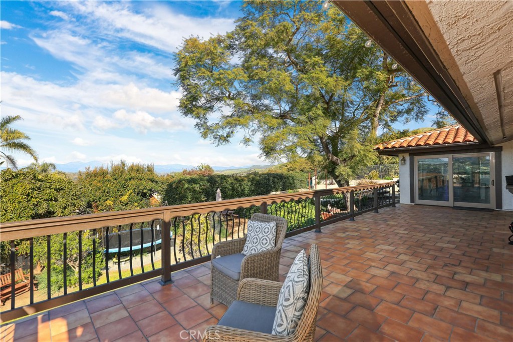 33532 Valle Road San Juan Capistrano, CA 92675 - Photo 56 of 60 a view of a house with backyard porch and sitting area