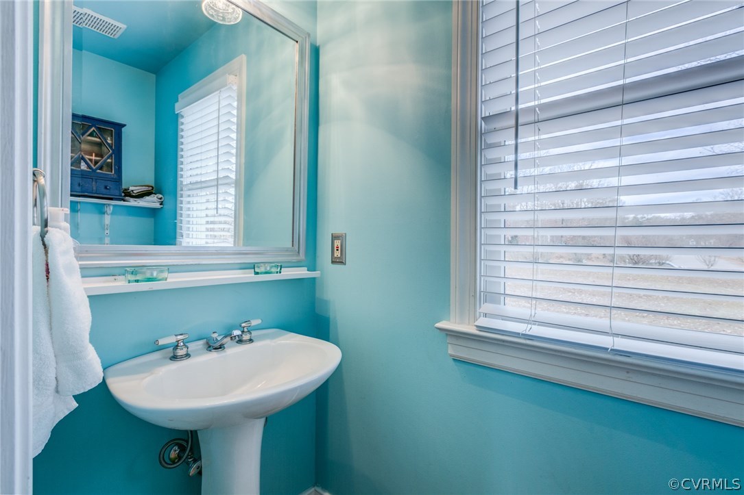 9501 Elkwood Road Midlothian, VA 23112 - Photo 9 of 22 Half bath is located off the laundry room which is