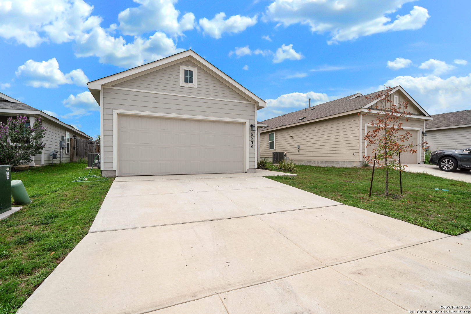 a front view of a house with garage