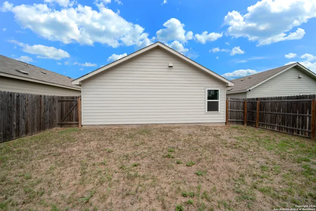 a view of backyard of house