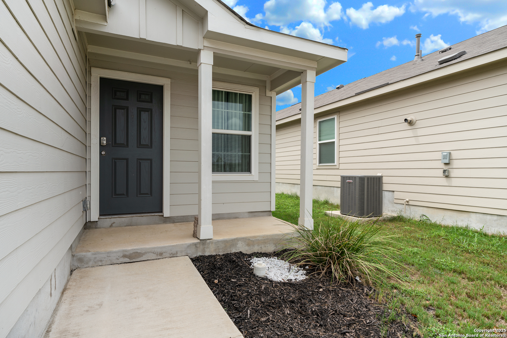 6534 Augustus Magee San Antonio, TX 78220 - Photo 4 of 25 a view of a house with a yard