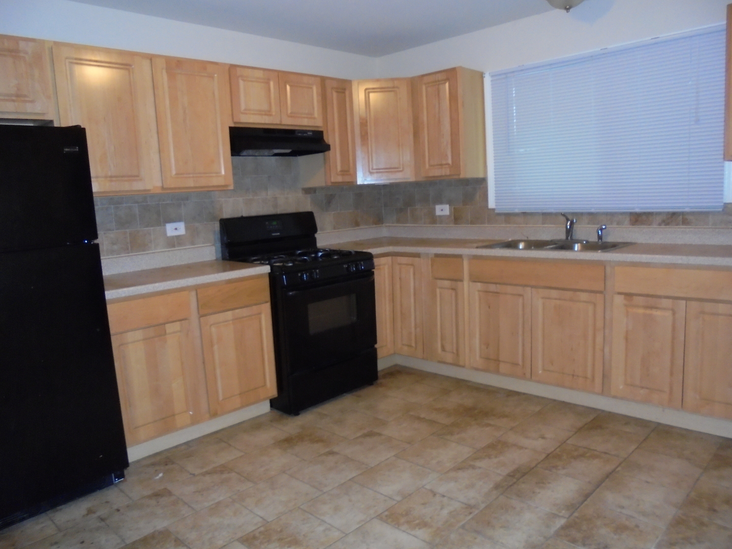14 Oakview Road Matteson, IL 60443 - Photo 5 of 12 a kitchen with a sink and a stove top oven