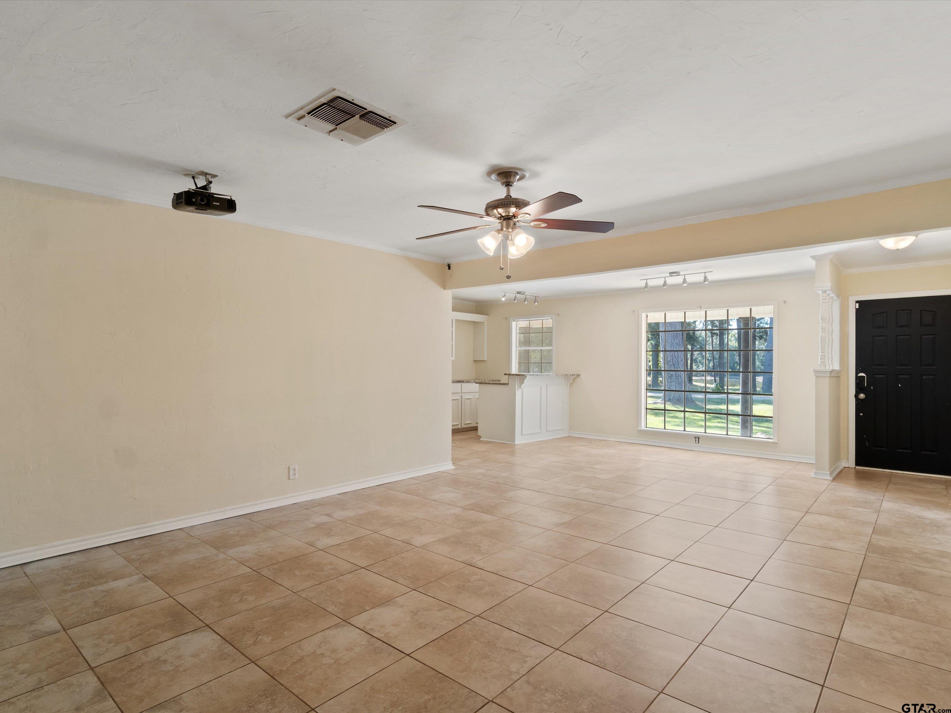 442 Golf Road Gilmer, TX 75645 - Photo 12 of 35 a view of an empty room with a window