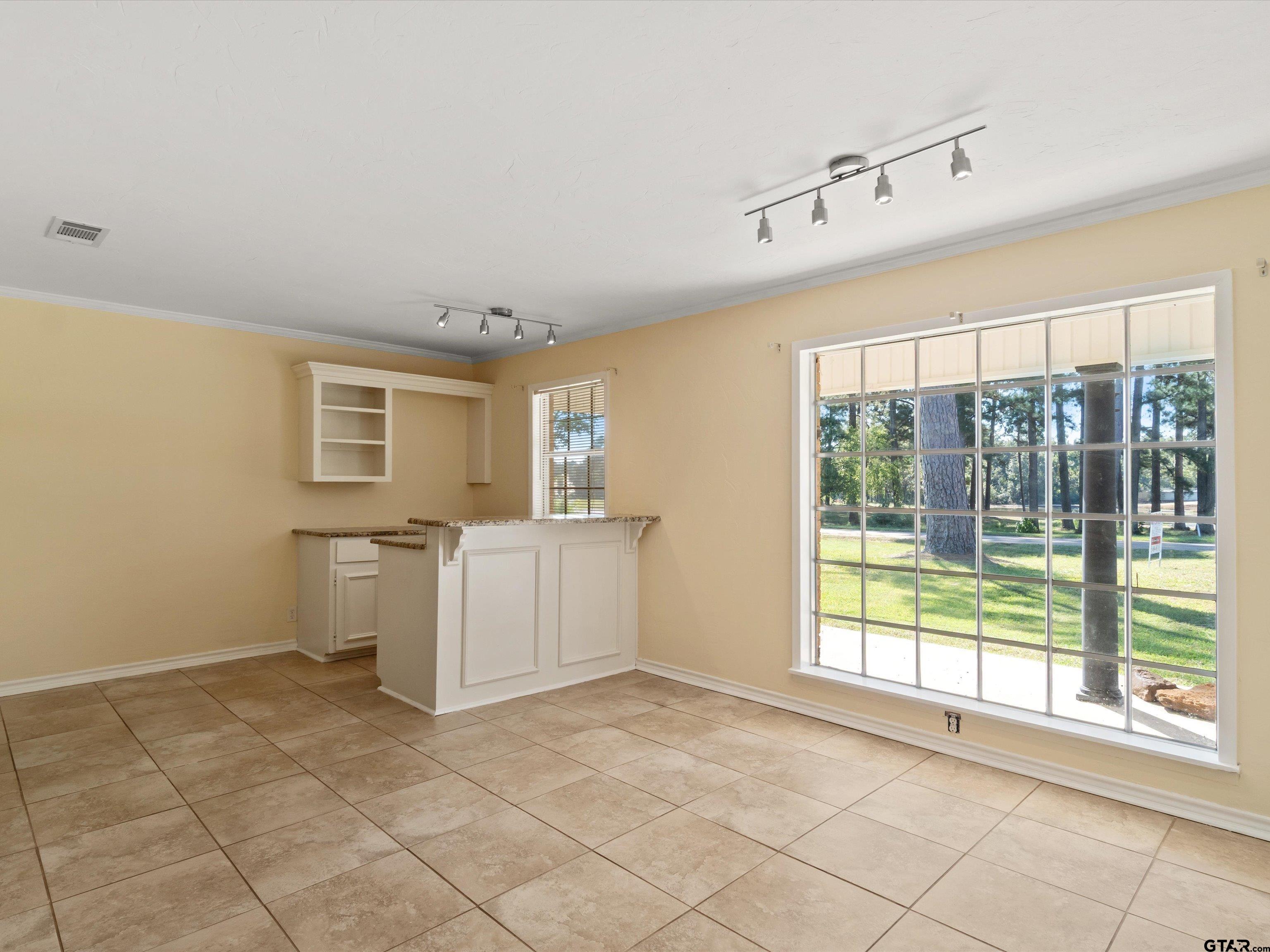 442 Golf Road Gilmer, TX 75645 - Photo 14 of 35 a view of an empty room with a window