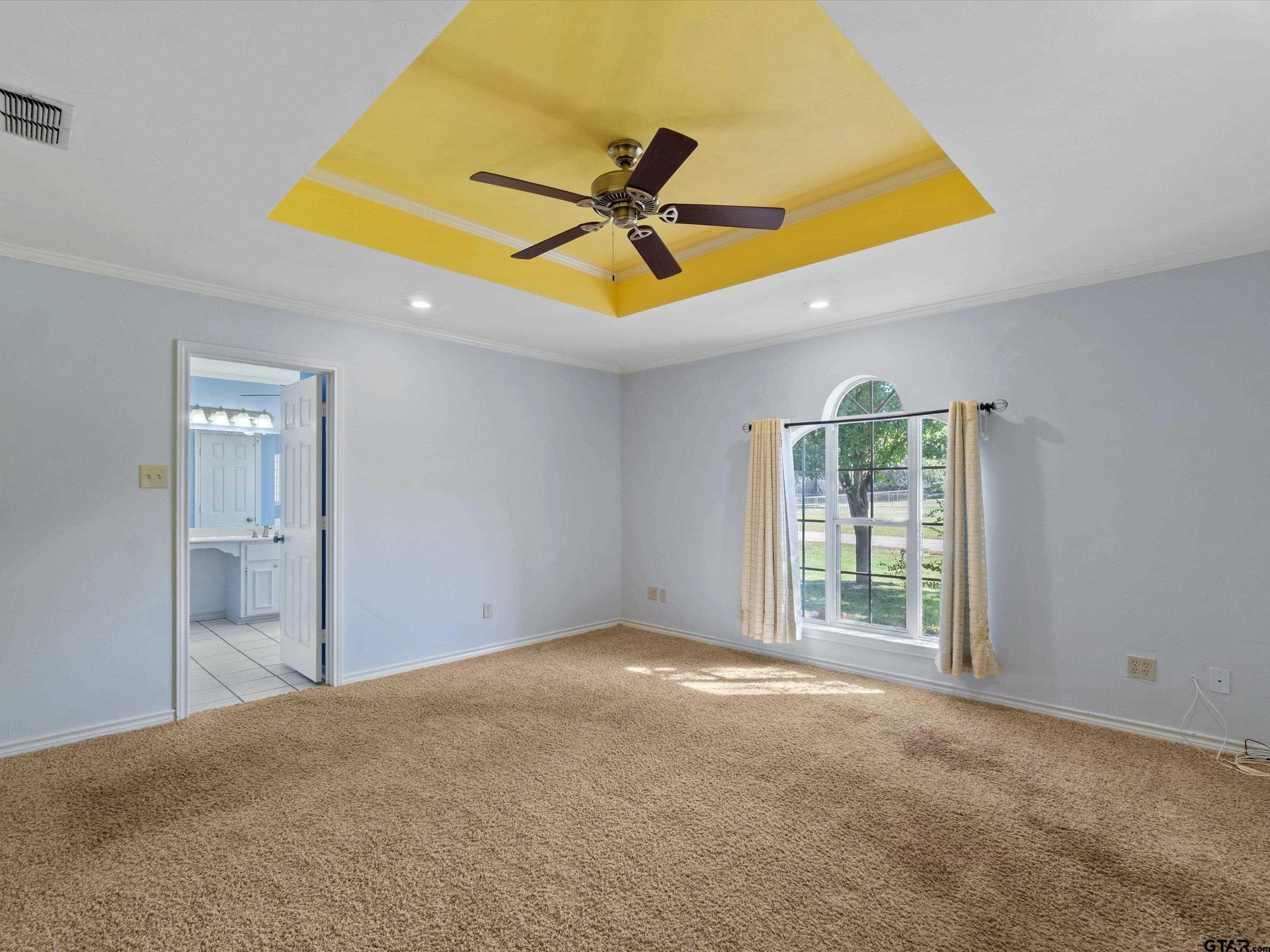 442 Golf Road Gilmer, TX 75645 - Photo 23 of 35 a view of a room with a ceiling fan and window