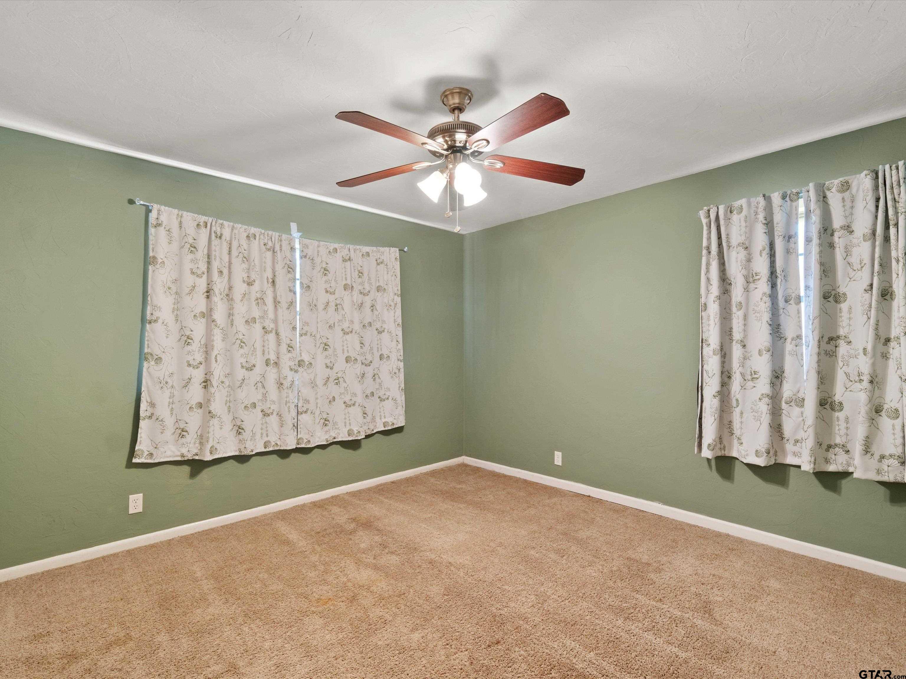 442 Golf Road Gilmer, TX 75645 - Photo 29 of 35 a view of an empty room with a window