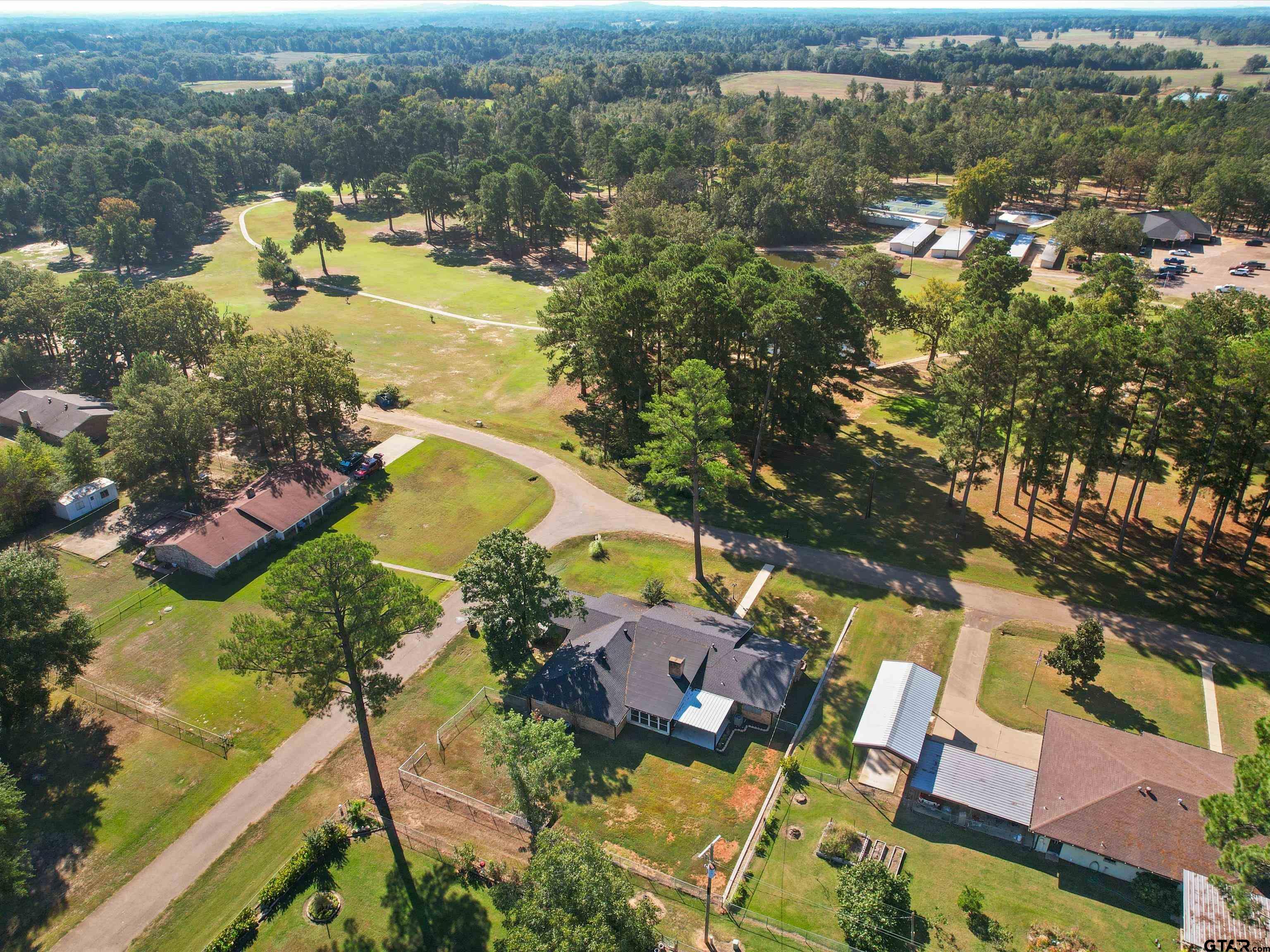 442 Golf Road Gilmer, TX 75645 - Photo 8 of 35 an aerial view of residential houses with outdoor space