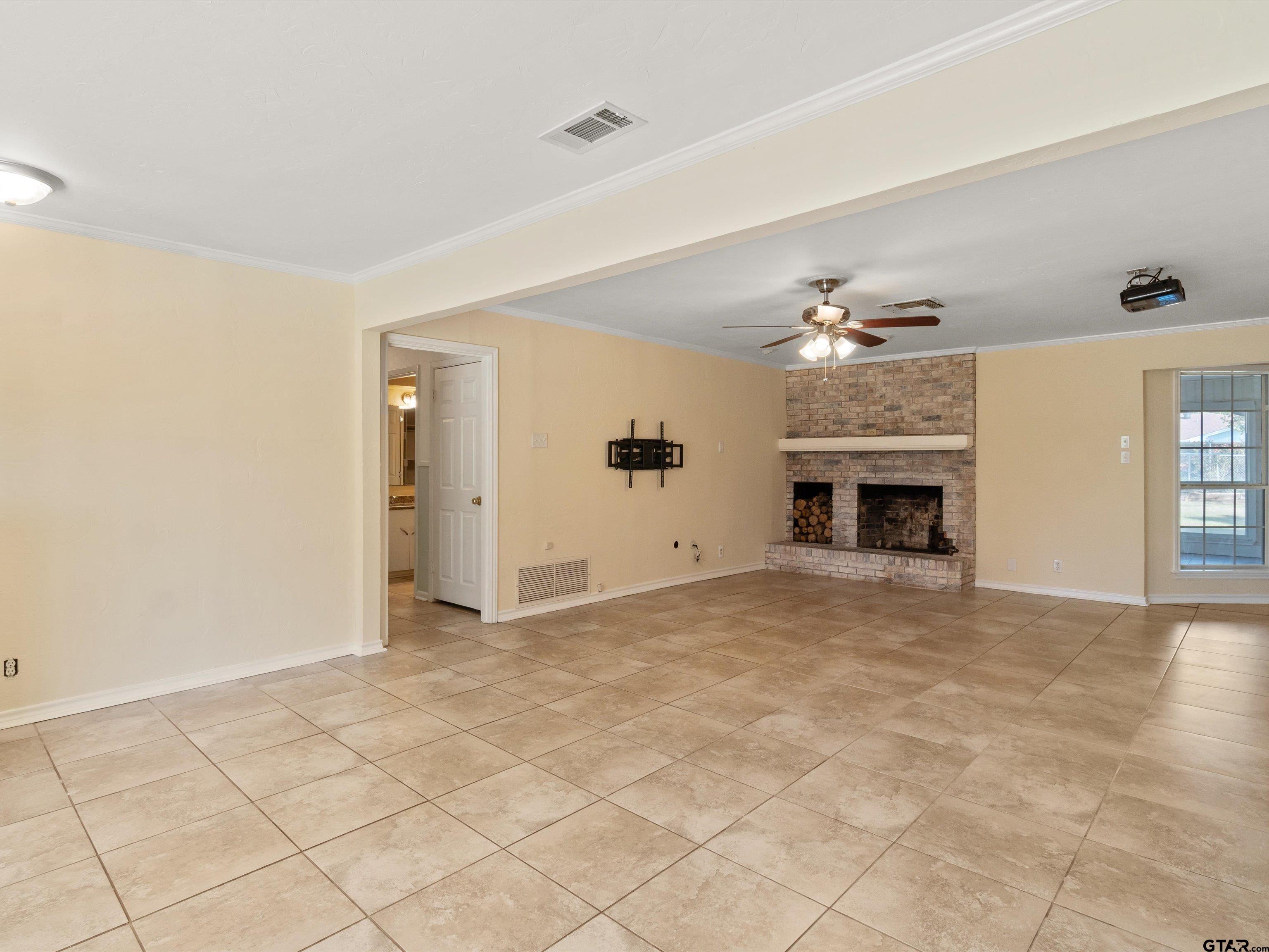 442 Golf Road Gilmer, TX 75645 - Photo 10 of 35 a view of an empty room and fire place