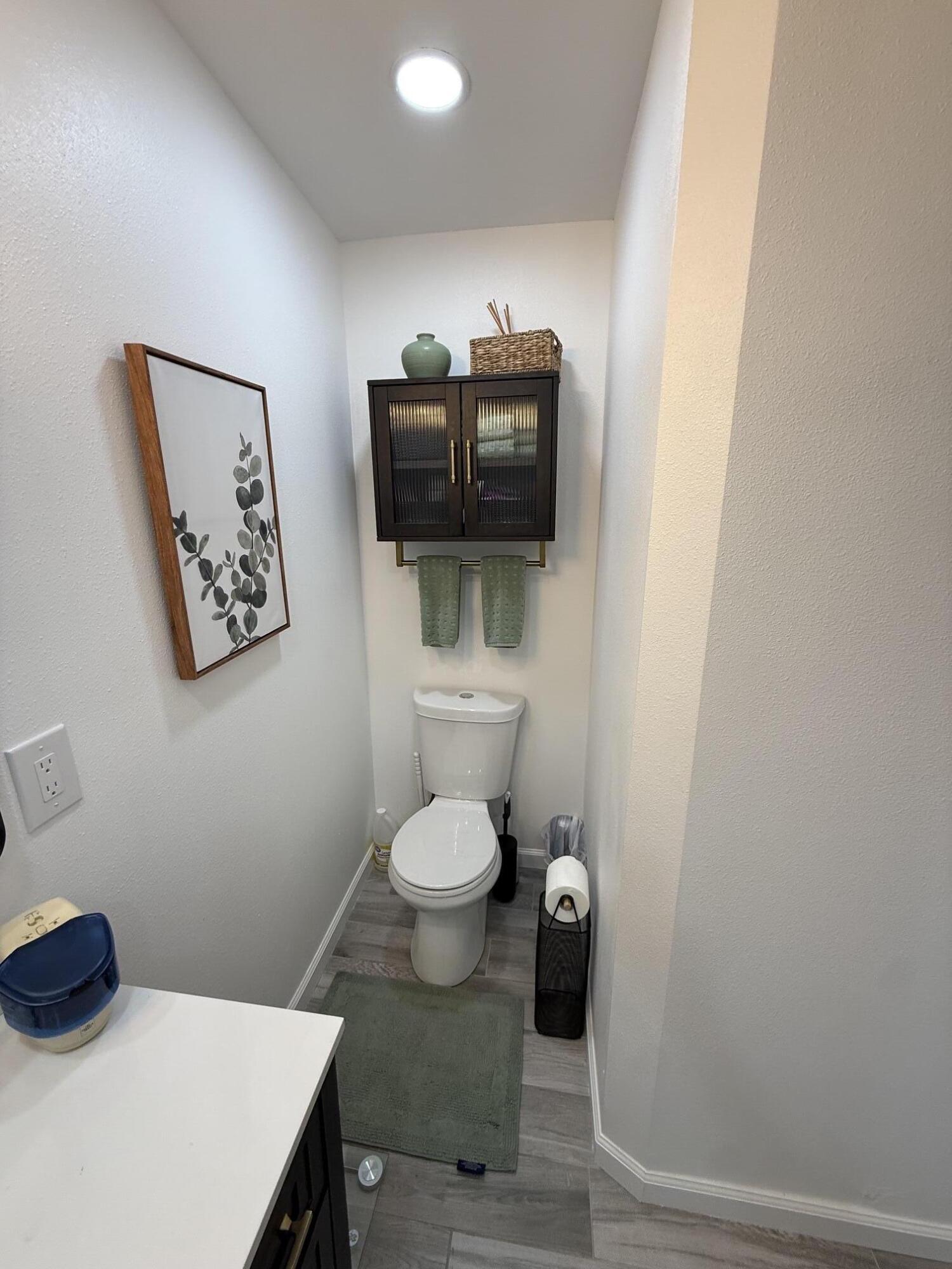 37081 Palmdale Road Rancho Mirage, CA 92270 - Photo 36 of 46 a bathroom with a toilet a sink and mirror