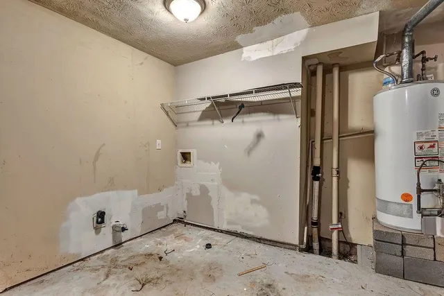 a bathroom with a tub and shower