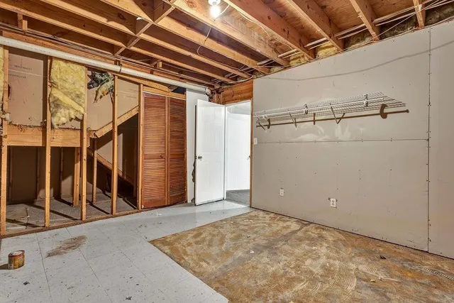 a view of a room with wooden walls