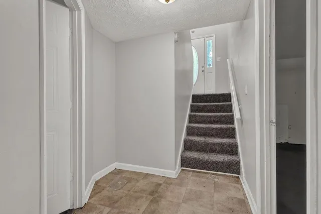 a view of entryway with stairs