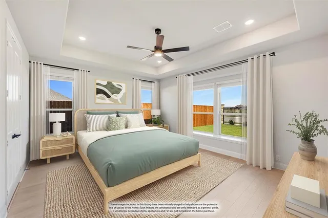 a bedroom with a large bed and a couch