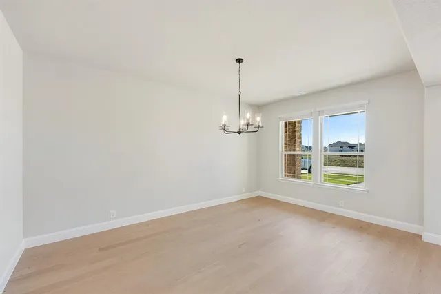 a view of empty room with windows