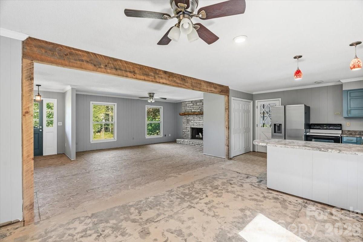 14 Jack Sullins Road Spruce Pine, NC 28777 - Photo 14 of 37 a view of a livingroom with furniture and a ceiling fan
