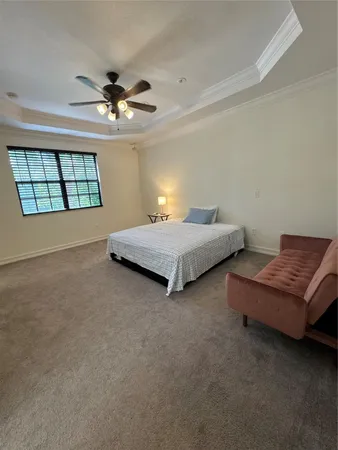 a bedroom with bed and window