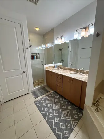 a room with a washing machine and cabinets