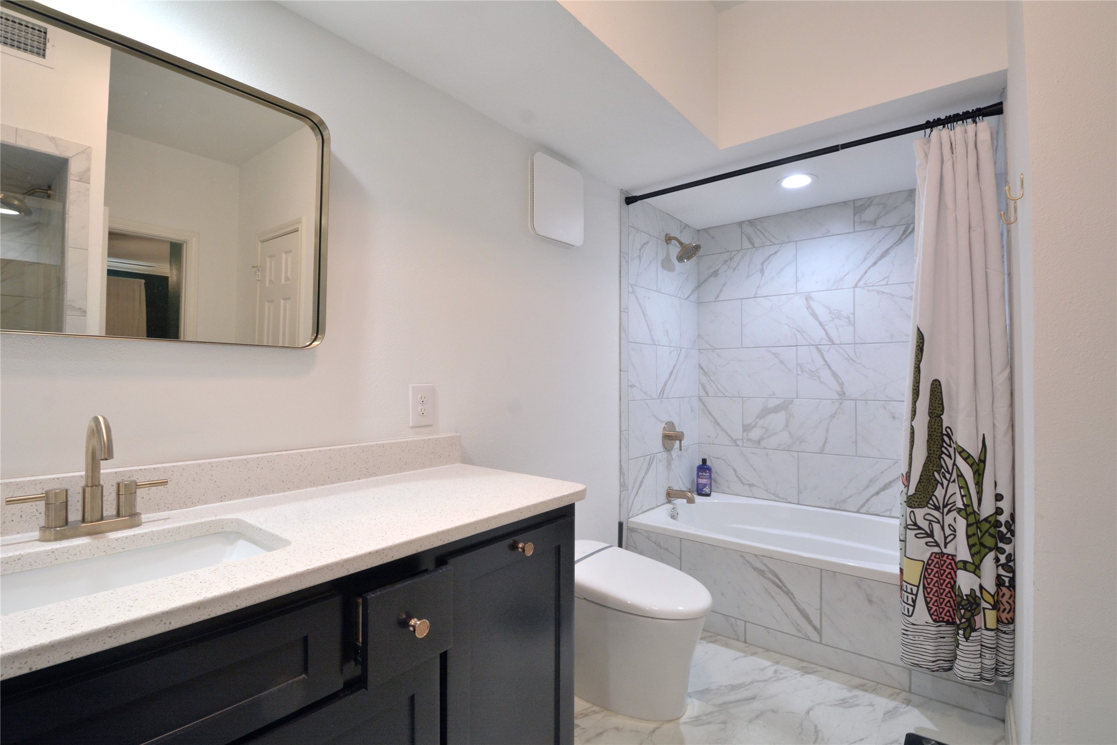 7701 Rialto Boulevard, Unit 124 Austin, TX 78735 - Photo 15 of 23 Modern bathroom featuring a single vanity with a solid surface countertop and a rectangular undermount sink