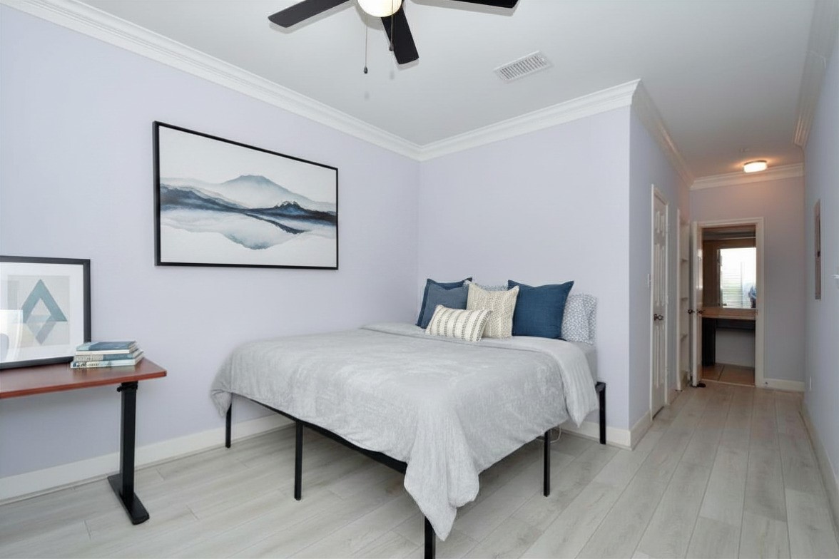 7701 Rialto Boulevard, Unit 124 Austin, TX 78735 - Photo 9 of 22 a bedroom with a bed and a painting on the wall