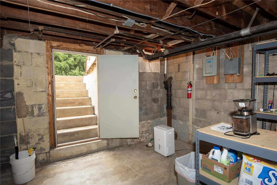706 Stones Crossing Road Easton, PA 18045 - Photo 27 of 40 Concrete block walls provide a robust foundation, offering durability and an external entrance to the property. Bilco doors lead to the very spacious yard.