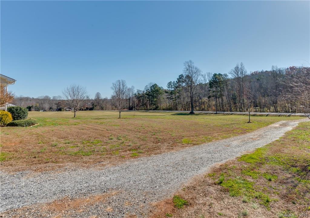 1632 Maple Creek Road Rutherfordton, NC 28139 - Photo 2 of 20 a view of a field with trees in the background