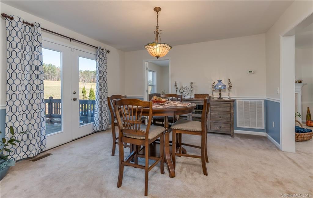 1632 Maple Creek Road Rutherfordton, NC 28139 - Photo 13 of 20 a view of a dining room with furniture window and wooden floor