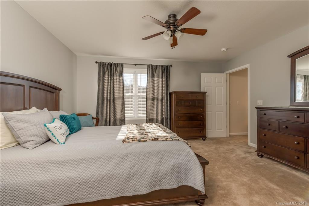 1632 Maple Creek Road Rutherfordton, NC 28139 - Photo 15 of 20 a bedroom with a bed a dresser and a window