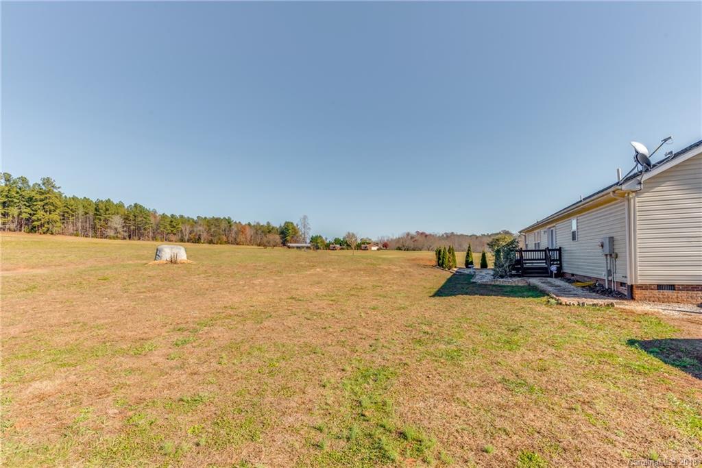 1632 Maple Creek Road Rutherfordton, NC 28139 - Photo 3 of 20 a view of a lake with houses