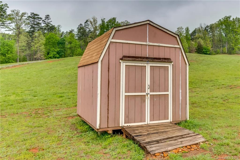 1632 Maple Creek Road Rutherfordton, NC 28139 - Photo 6 of 20 a view of a tiny house with yard