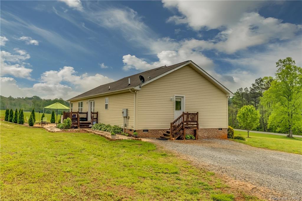 1632 Maple Creek Road Rutherfordton, NC 28139 - Photo 7 of 20 a view of a house with sitting area and yard