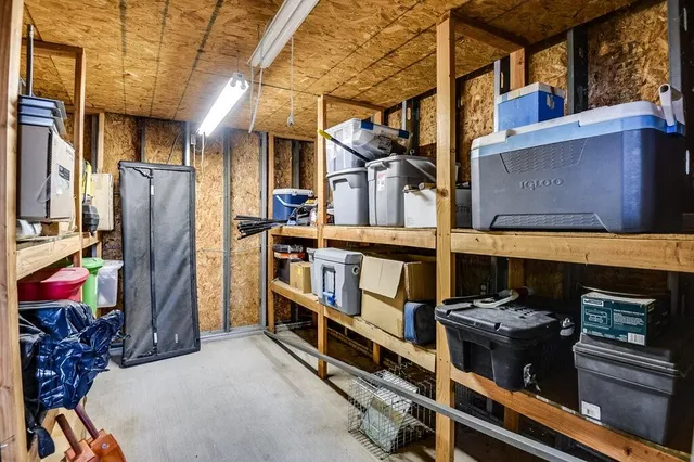 a view of a livingroom with furniture and a window