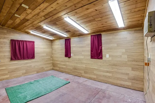 a view of room with window and wooden floor