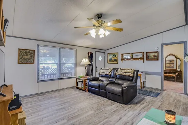 a kitchen with stainless steel appliances granite countertop a refrigerator sink and cabinets