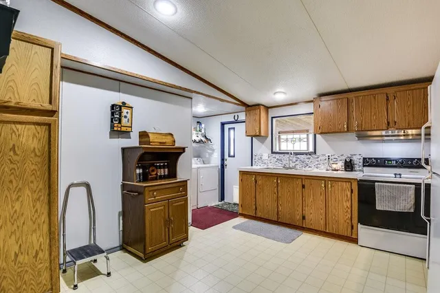a bathroom with a sink mirror vanity and toilet