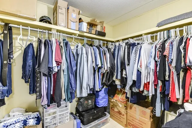 a view of an house with backyard space and a lake view