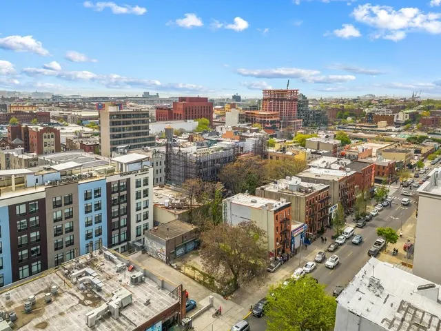 a view of city with ocean