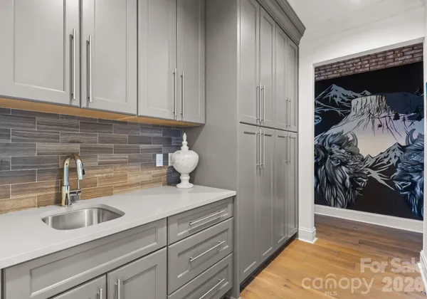 a kitchen with a sink and cabinets