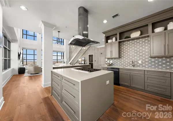 a kitchen with stainless steel appliances granite countertop a stove and a sink