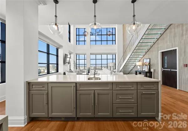 a kitchen with a sink window and cabinets