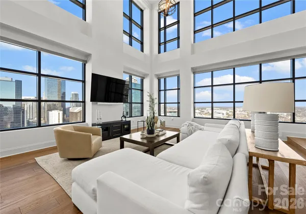 a living room with furniture fireplace and a flat screen tv