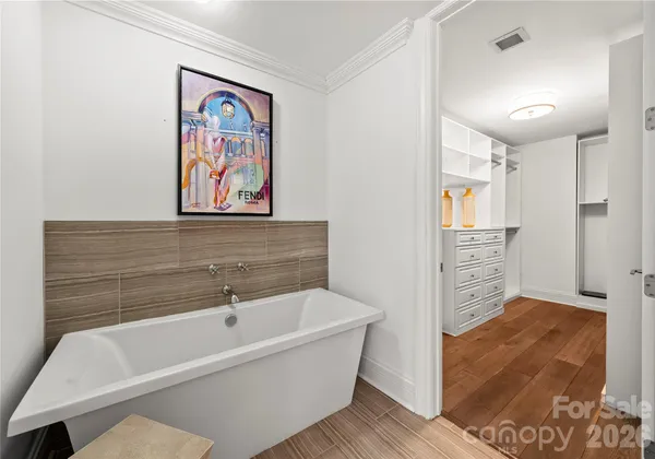 a bathroom with a bathtub and a shower