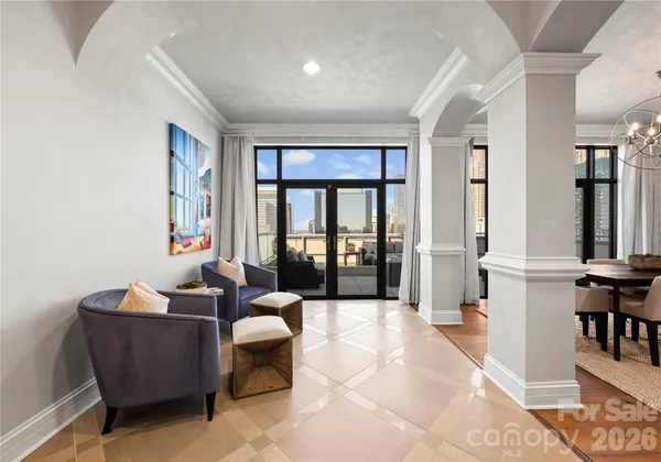 a living room with furniture and a large window