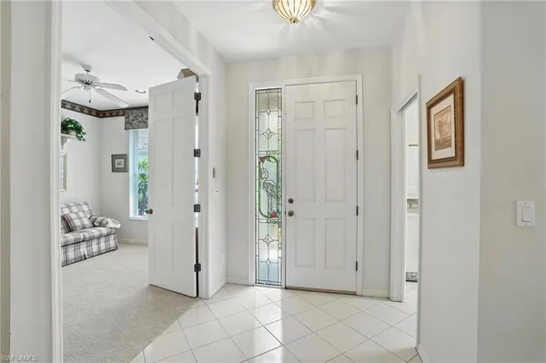 a view of a livingroom with tub and hallway