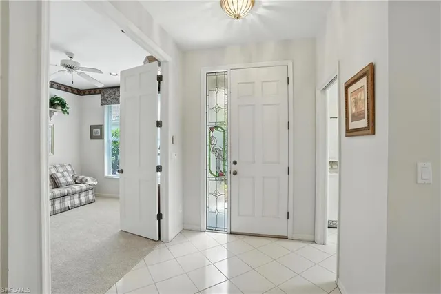 a view of a livingroom with tub and hallway