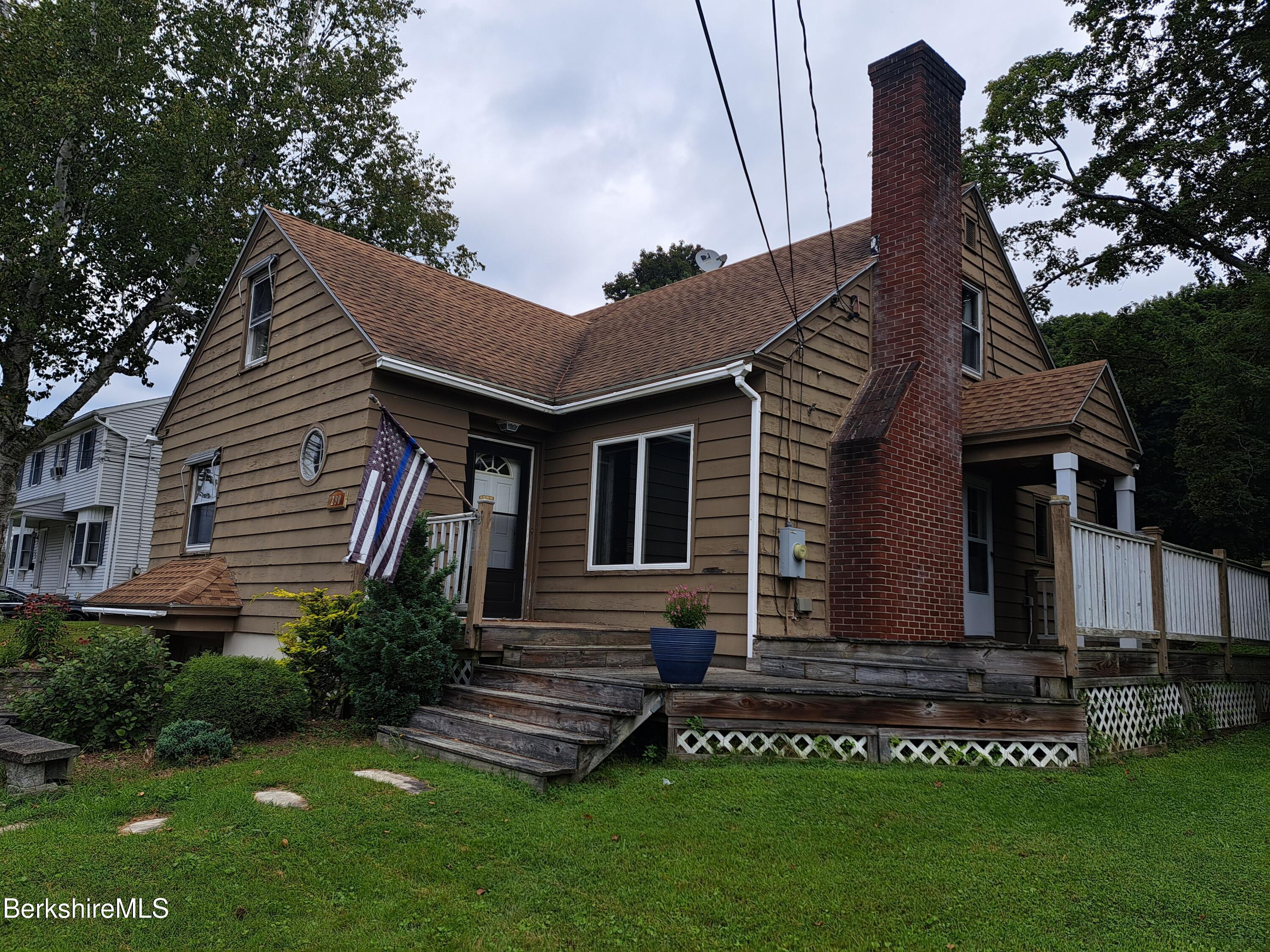 290 Lenox Avenue, Unit 1 Pittsfield, MA 01201 - Photo 1 of 8 a front view of a house with a garden