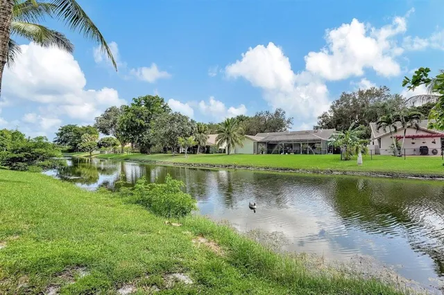 a view of a lake with a big yard
