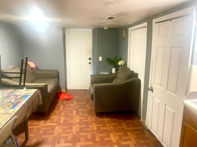 a living room with furniture and a gate