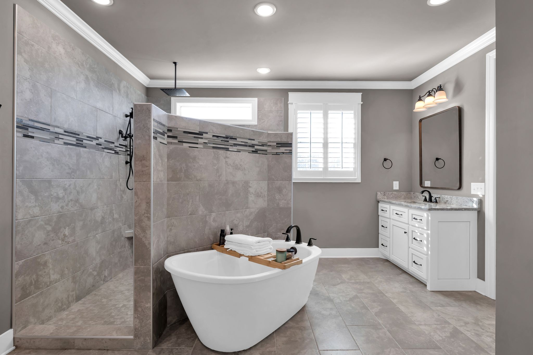 1032 Abbey Rd Way Spring Hill, TN 37174 - Photo 25 of 51 a bathroom with a sink mirror and a bathtub